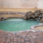 pavers, pool and rock water feature