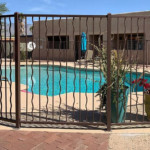decorative iron fencing around swimming pool