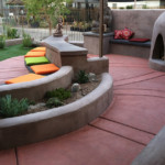 decorative terracotta colored concrete patio and bench
