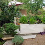 stone patio with tropical landscaping